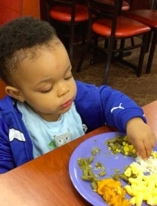 toddler eating vegetables