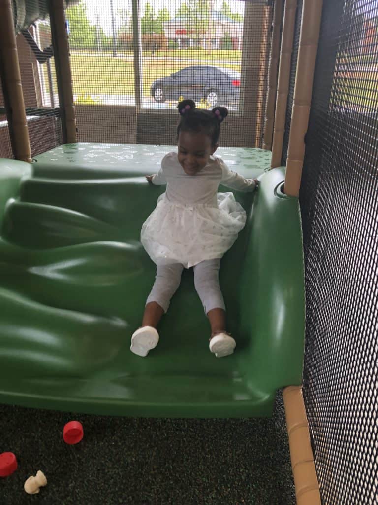 toddler on Indoor slide