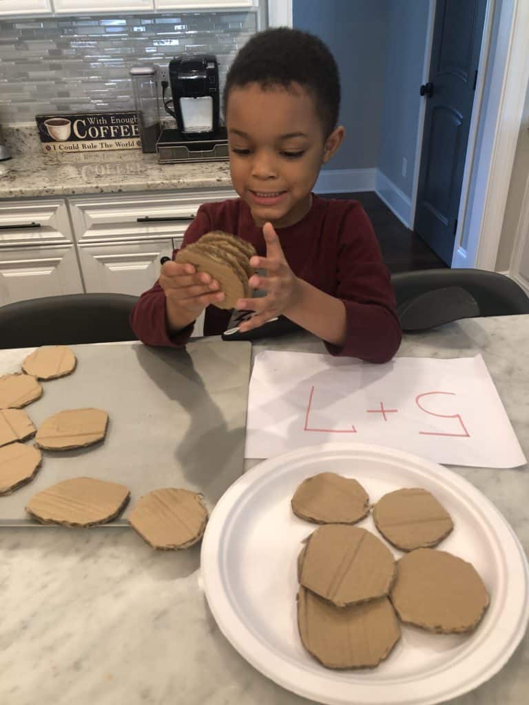 Fun Preschool learning activities are a great way to get your kids interested in math! Pretend play preschool activities combined with preschool math games will be a hit. My toddler enjoyed this activity idea too.