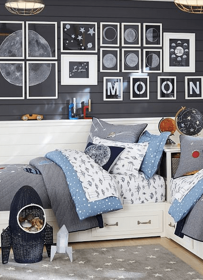 I love this rocket wicker storage basket! It adds so much to a spaced themed kids bedroom. For other great bedroom storage ideas, visit this page! #bedroomideas #kidsbedroomorganization