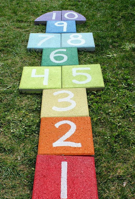 rainbow hopscoth, kid friendly backyard ideas on a budget