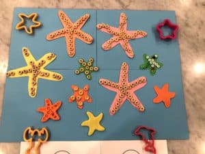 Starting Early With Toddler Fine Motor Skills Activities Is An Absolute Must! This Star Fish Decorating Craft Is A Super Easy Way To Practice Those Fine Motor Skills That Can Help With Development.