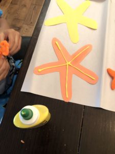 Starting Early With Toddler Fine Motor Skills Activities Is An Absolute Must! This Star Fish Decorating Craft Is A Super Easy Way To Practice Those Fine Motor Skills That Can Help With Development.
