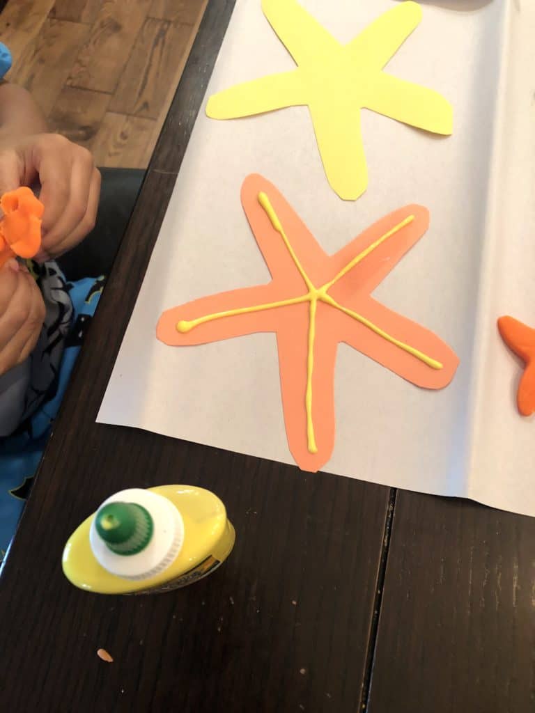 Starting Early With Toddler Fine Motor Skills Activities Is An Absolute Must! This Star Fish Decorating Craft Is A Super Easy Way To Practice Those Fine Motor Skills That Can Help With Development.