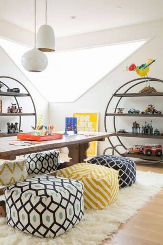 I love this farmhouse craft table combined with colorful ottoman seats and rounded shelving! Perfect atmosphere for play and homeschool learning