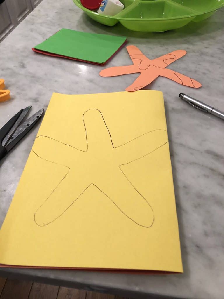 Starting Early With Toddler Fine Motor Skills Activities Is An Absolute Must! This Star Fish Decorating Craft Is A Super Easy Way To Practice Those Fine Motor Skills That Can Help With Development.