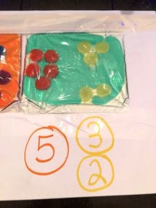 Sensory Activities For Toddlers Are An Absolute Must For Early Development Through Play And Good Plain Fun! This Easy Pom Pom Sensory Bag Is Super Easy and Cool. Great Sensory Bags for Babies Too!