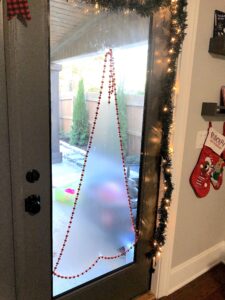 This Christmas Tree Craft For Kids Will Be A Hit For The Holidays! This Activity Uses Contact Paper To Create A Fun And Unique Christmas Craft Experience. #christmascrafts #christmascraftsforkids